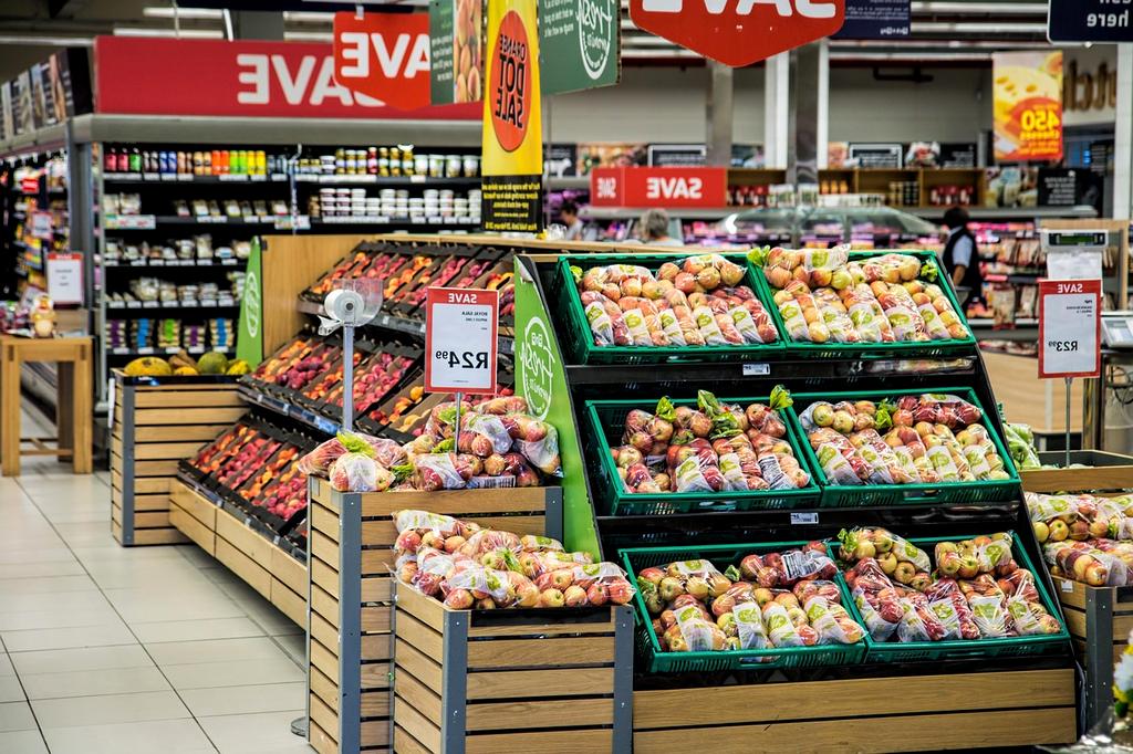 Fresh organic produce in a modern supermarket aisle