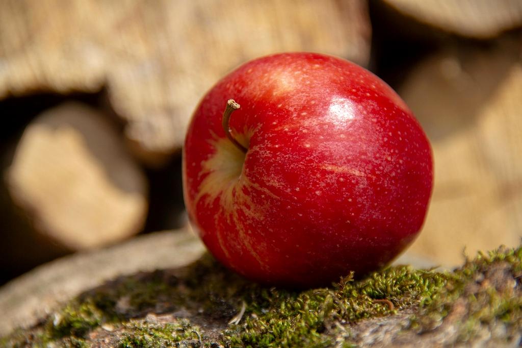Fresh organic red apples in a crate